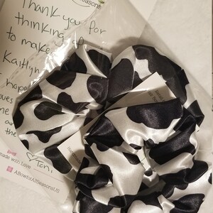 kaitlyn scheiber added a photo of their purchase