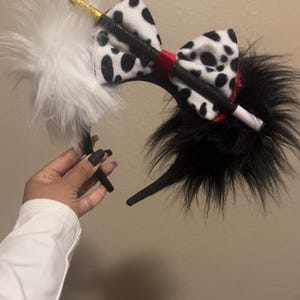 Cruella Disney ears.