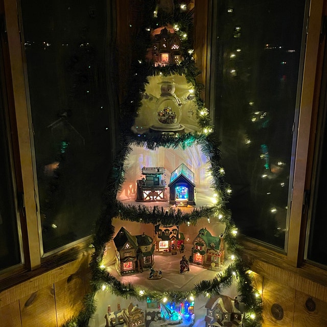 Christmas Village Display Idea with a Christmas tree shaped Shelf