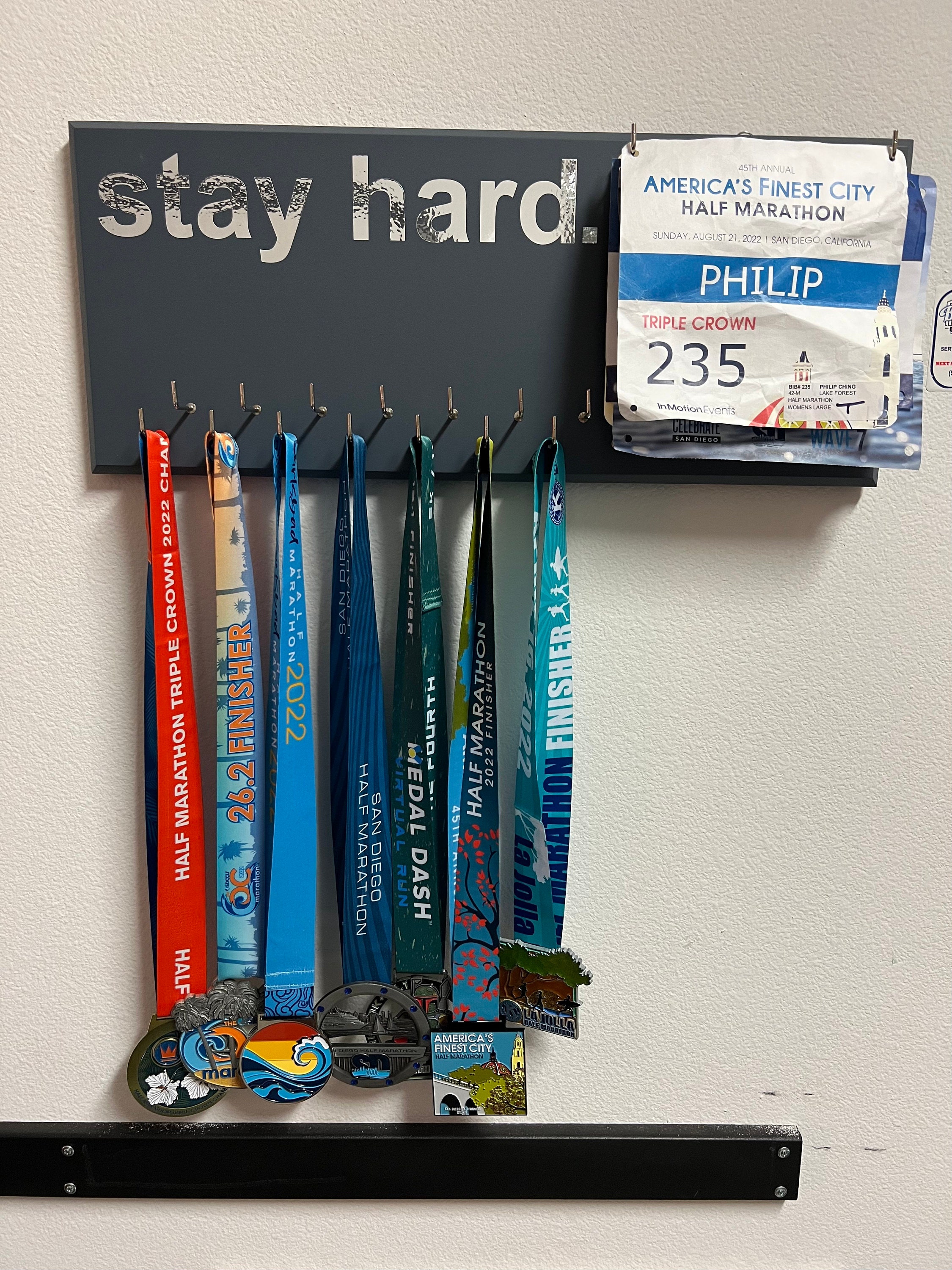 Running Medal Holder, gray or black with chrome "run." vinyl, 21 hooks and BIB holder