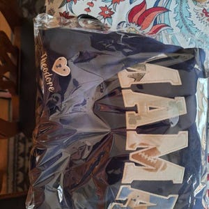 Sheila added a photo of their purchase