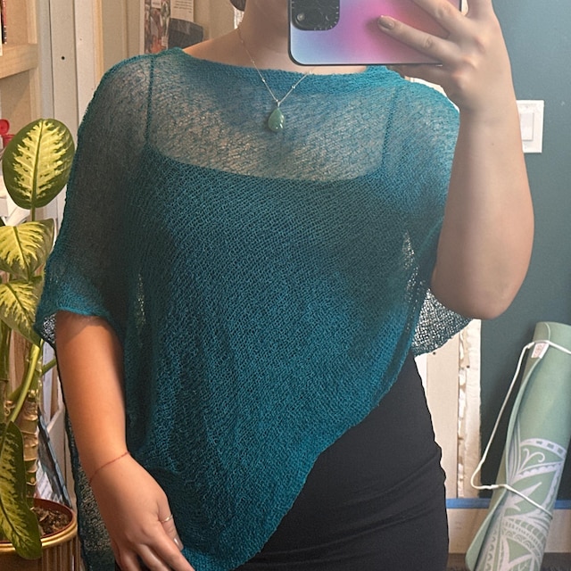 Brianna wearing the teal Prema Poncho