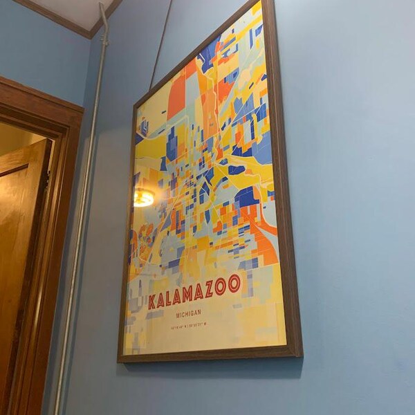 Lafayette, Indiana, a bridge over a river with buildings and a starry