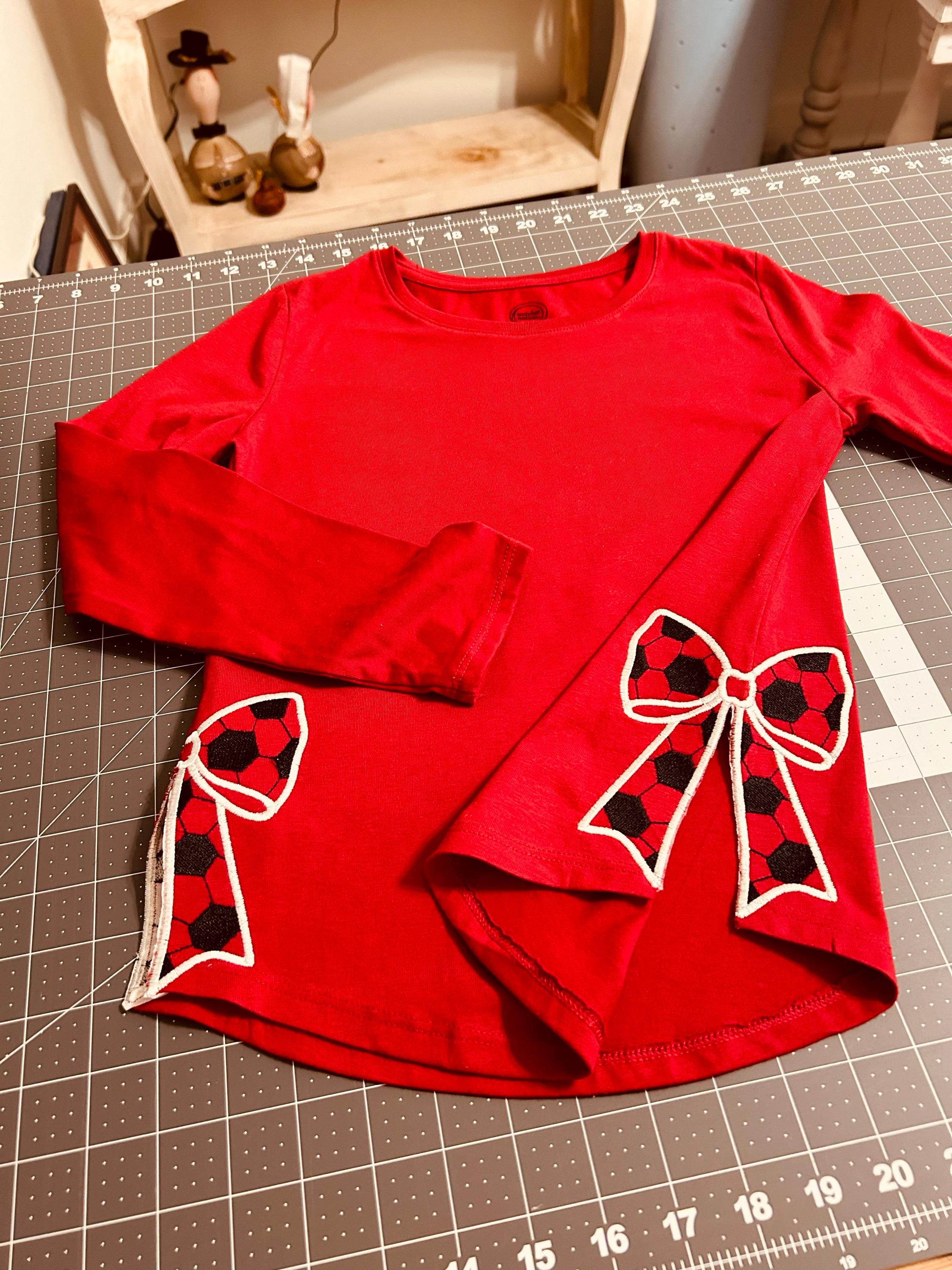 Customer project using Soccer Ball Side Seam Bow Applique embroidery design