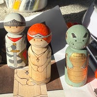 A Range Of 5 Painted Christmas Character Carvings Of Santa, Mrs Claus, An Elf, Snowman, And Ginger Bread Man - 3D Render Stock Photo