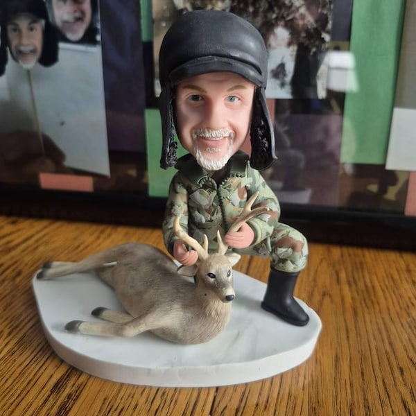 Etsy buyer's Etsy review photo of a Hunter and deer bobblehead