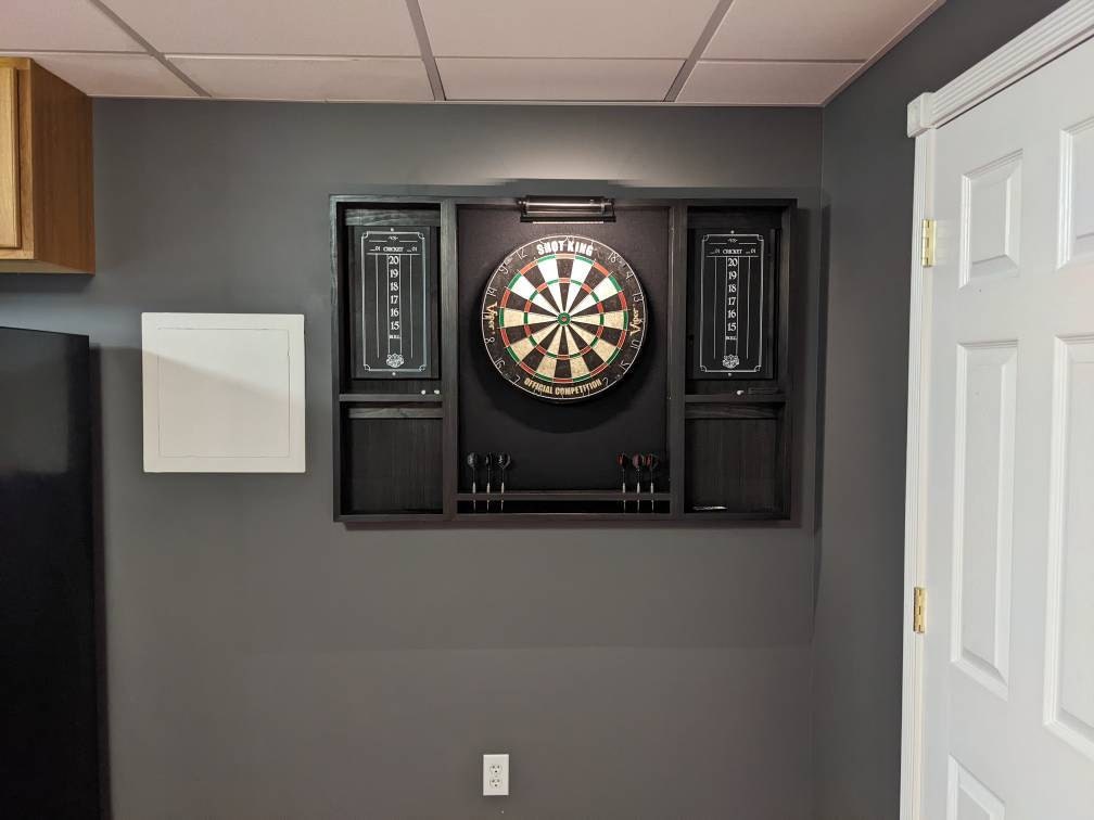 Makes a great fathers day gift  Our best selling Black dartboard cabinet with a Dartboard, darts, led light. and 2 scoreboards.