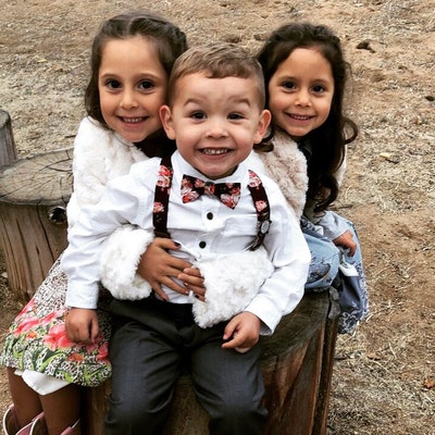 burgundy bow tie and suspenders wedding