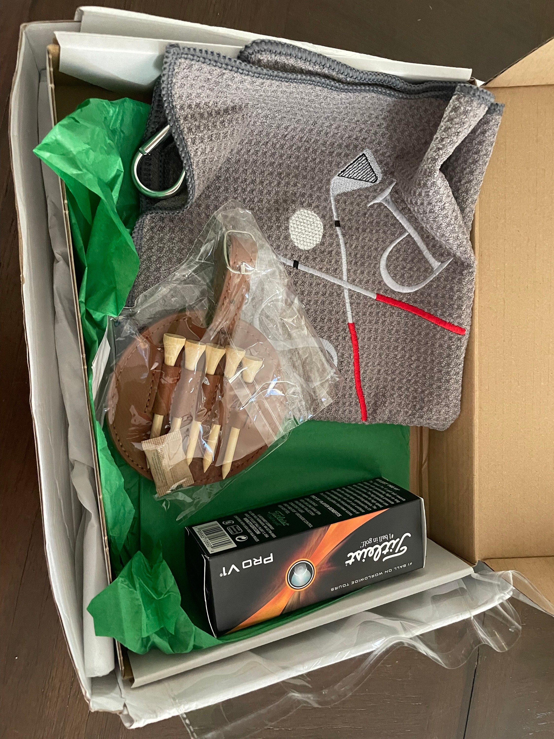 Personalized Golf Gift Box. Include a golf towel, a set of three golf Pro V1 balls with monograms, and a golf bag tag with tee holder