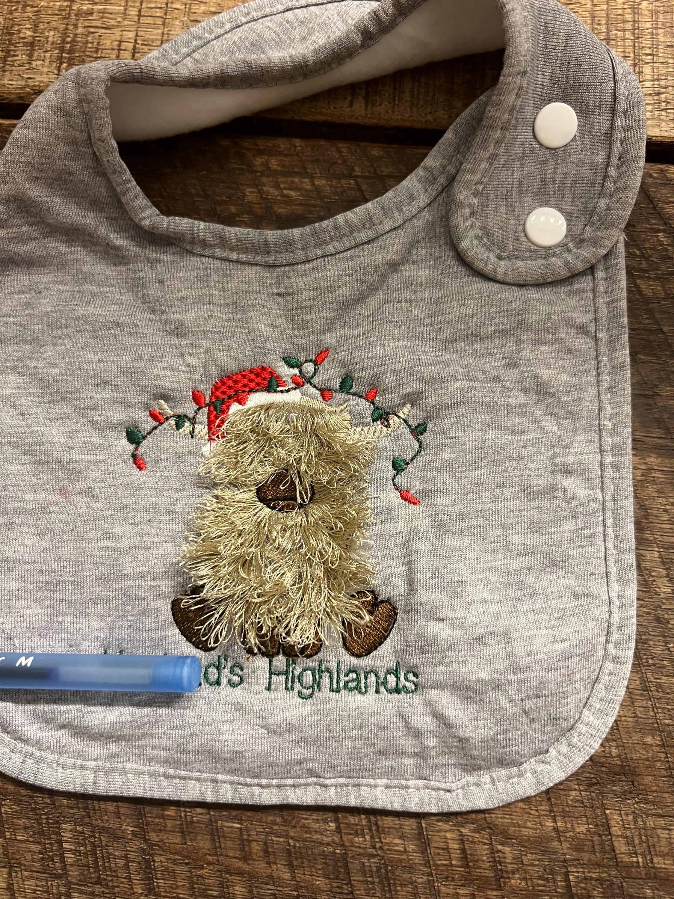 Customer project using Little Highland Cow Calf with Santa Hat embroidery design
