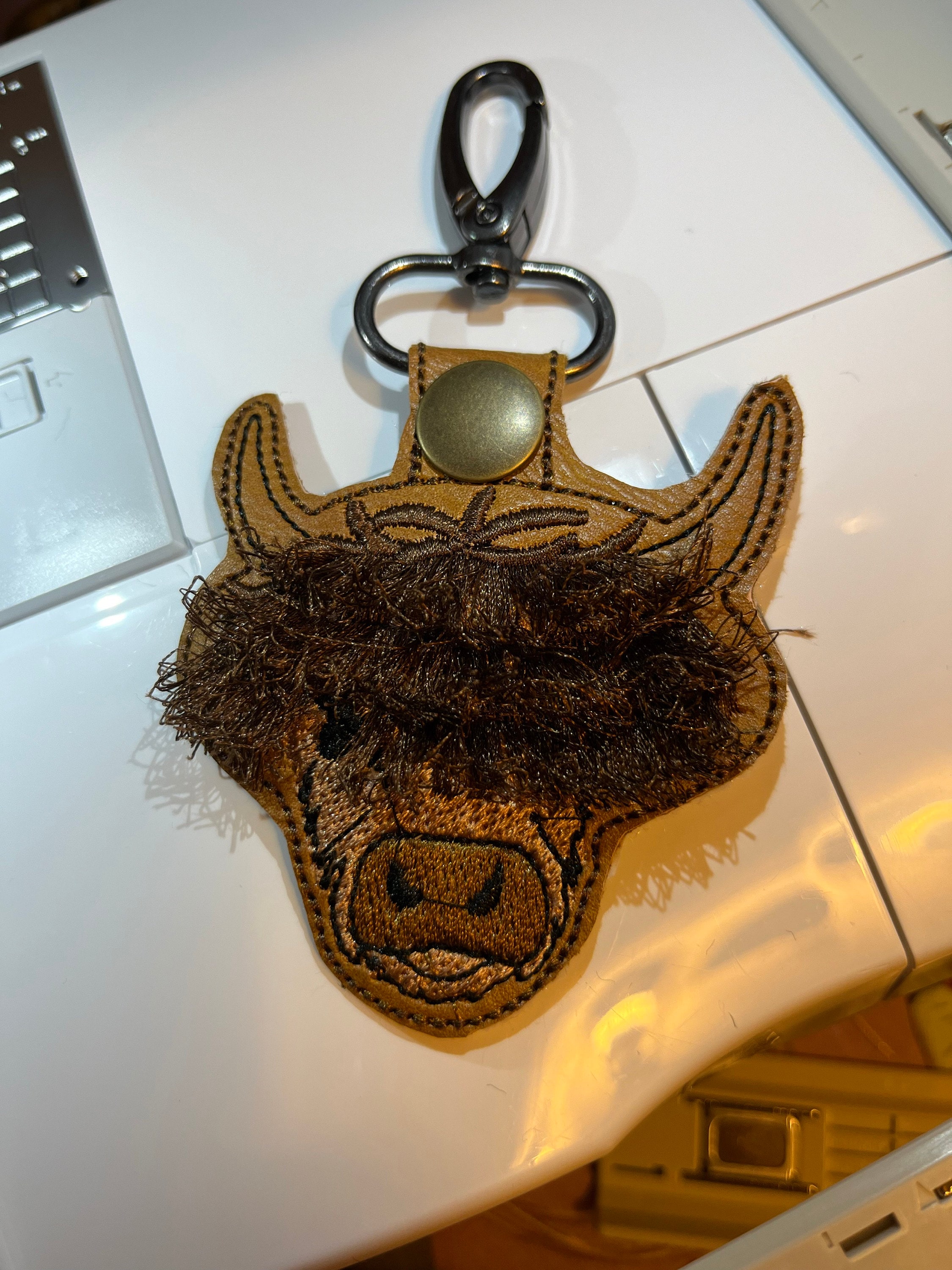 Fringed Highland cow keychain key fob snap tab in the hoop machine embroidery designs ITH project Awesome fluffy fur cow kids backpack tag