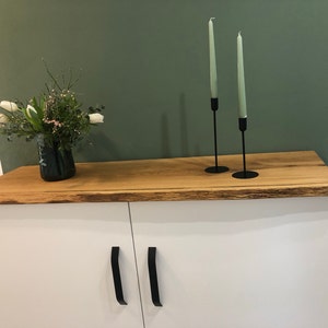 Alexandra added a photo of their purchase