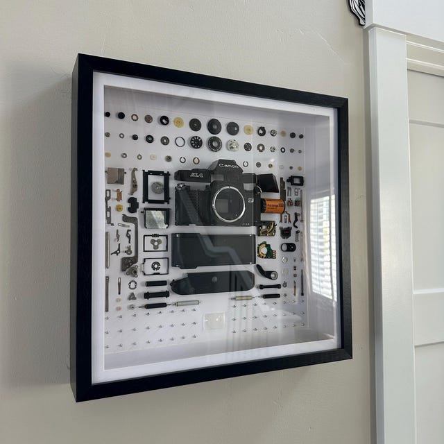 Disassembled Canon Nikon Pentax Camera With Frame, Deconstructed