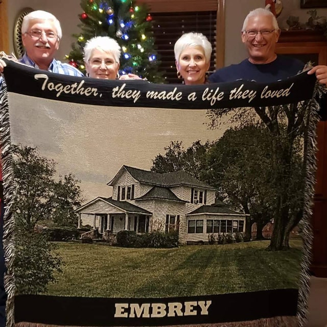 family with photo blanket