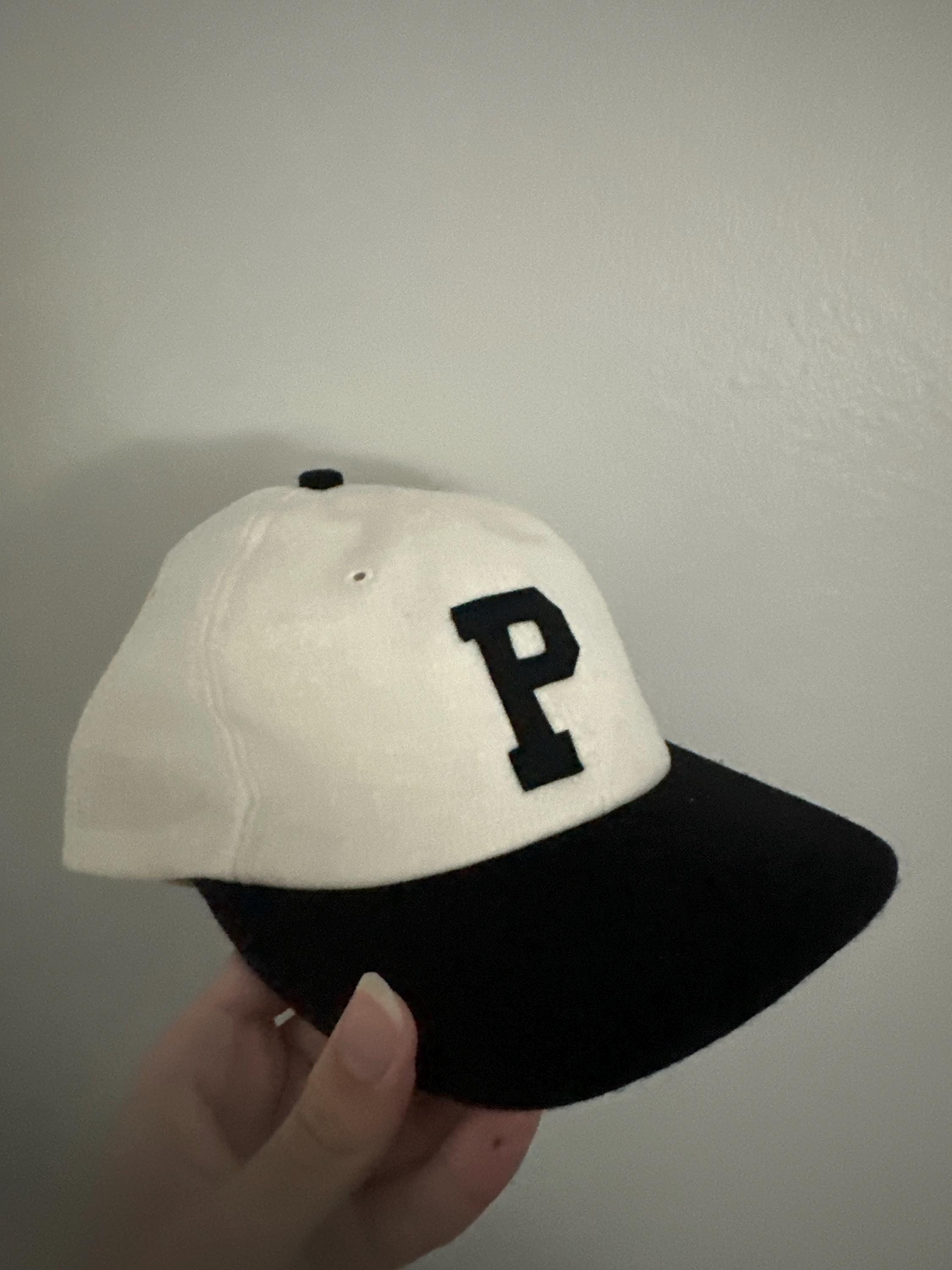 White wool flannel 6 panel cap, black 2 1/2 in. visor. Hand cut