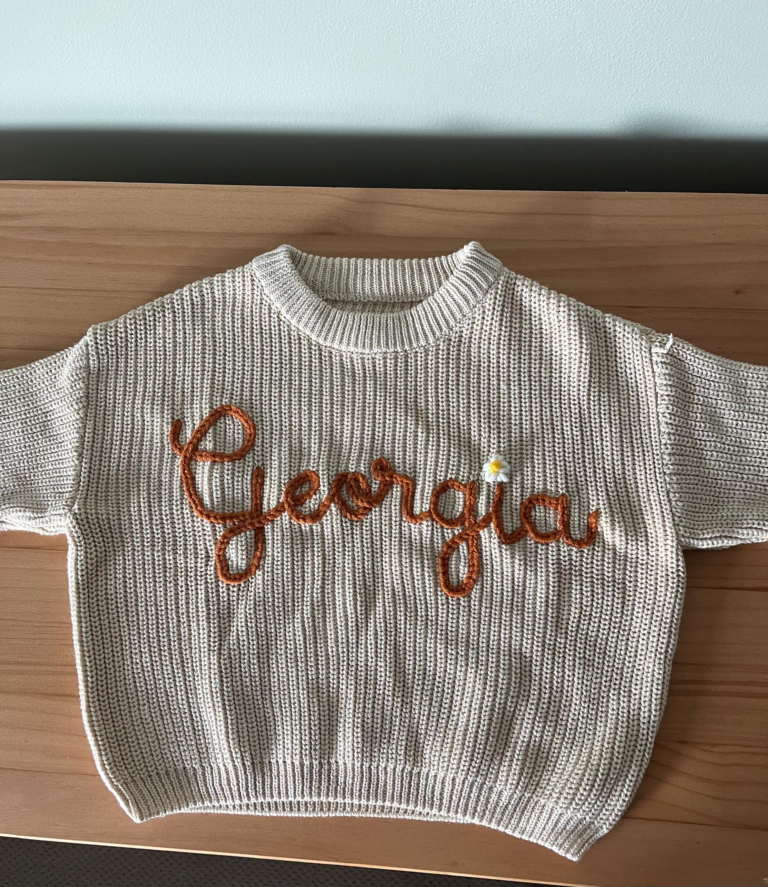 Cherished Custom Baby Sweaters: Personalize Their Name with Exquisite Embroidery