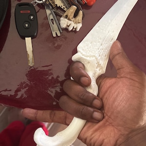 La’Tique added a photo of their purchase