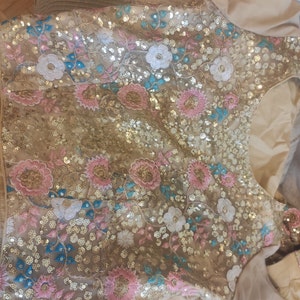 Lana Off White Embroiderd Choli With Hanging Flowered Tassels On Shoulder And Lehenga