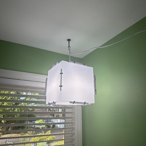 White Nordic design pendant light. Easy to assemble origami style light fixture. Eco-friendly multipurpose lamp to hang or place. Zen light.