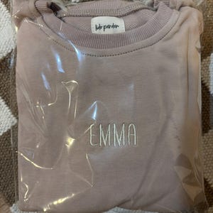 Mayra added a photo of their purchase