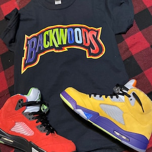 university blue jordan 9 shirt