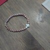 White Beaded turq. with Antique Copper Cross 255s main image 0