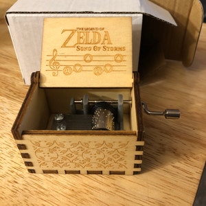  The Legend of Zelda Music Box Hand Crank Musical Box Carved  Wooden,Play Zelda:Song of Storms from Ocarina of Time,Brown : Home & Kitchen