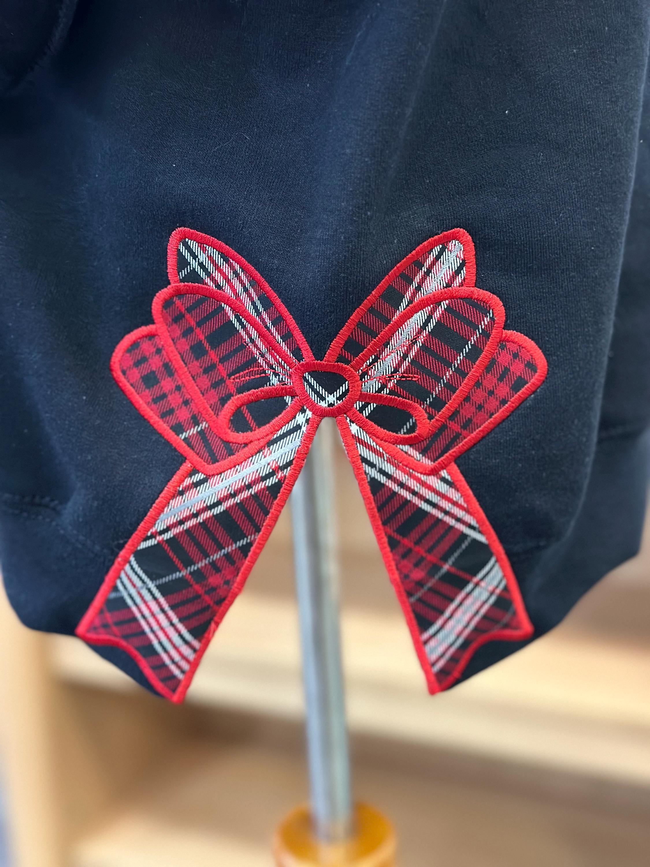 Customer project using Football Stitch Bow and Heart Applique embroidery design