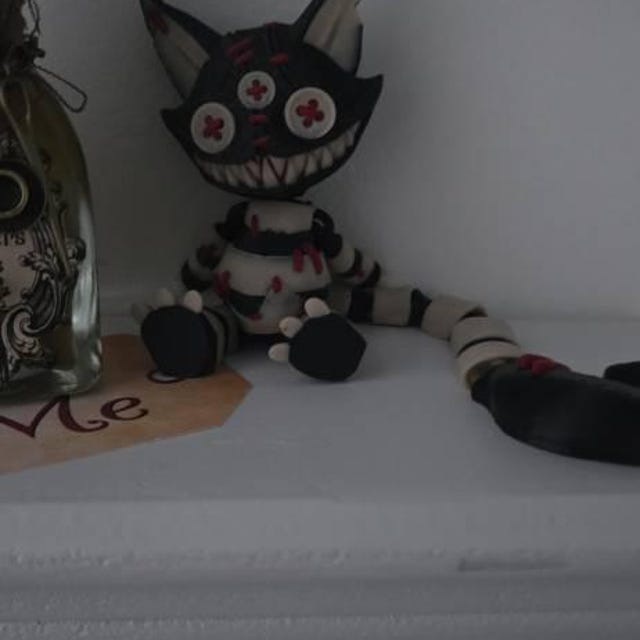 Articulated Cheshire Cat Figurine - Creepy Stuffed Cat Design