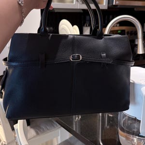 Natasha added a photo of their purchase