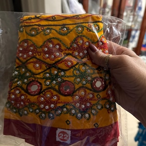 Sangeeta added a photo of their purchase
