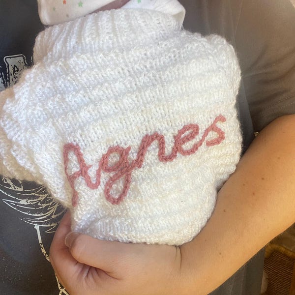 Personalised baby cardigan hand knitted for newborn baby hand