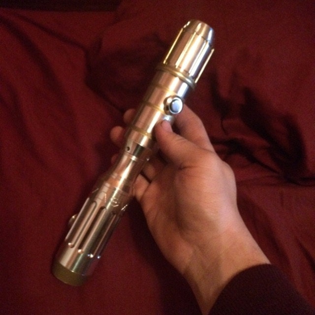 Close-up of hilt treatment. Leather wrap finished off with deer hide laces  and a few O rings. : r/lightsabers