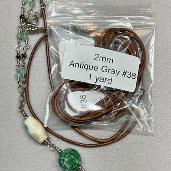 thumbnail image 2 of 4mm Braided Genuine Black Leather Cord With Ribbed Metal Gold Tips – For Bolo Ties Or DIY Crafts 2 of 3