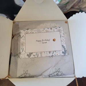 Sarah added a photo of their purchase