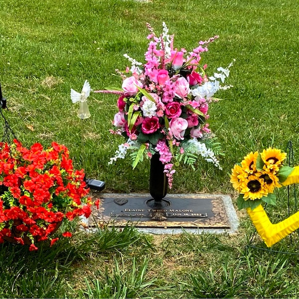 Pink and Yellow. Ranunculus, and Roses Grave Flower Arrangement ...