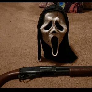 GhostFace with a Shotgun' by @shawnmansfieldart. . #scream6