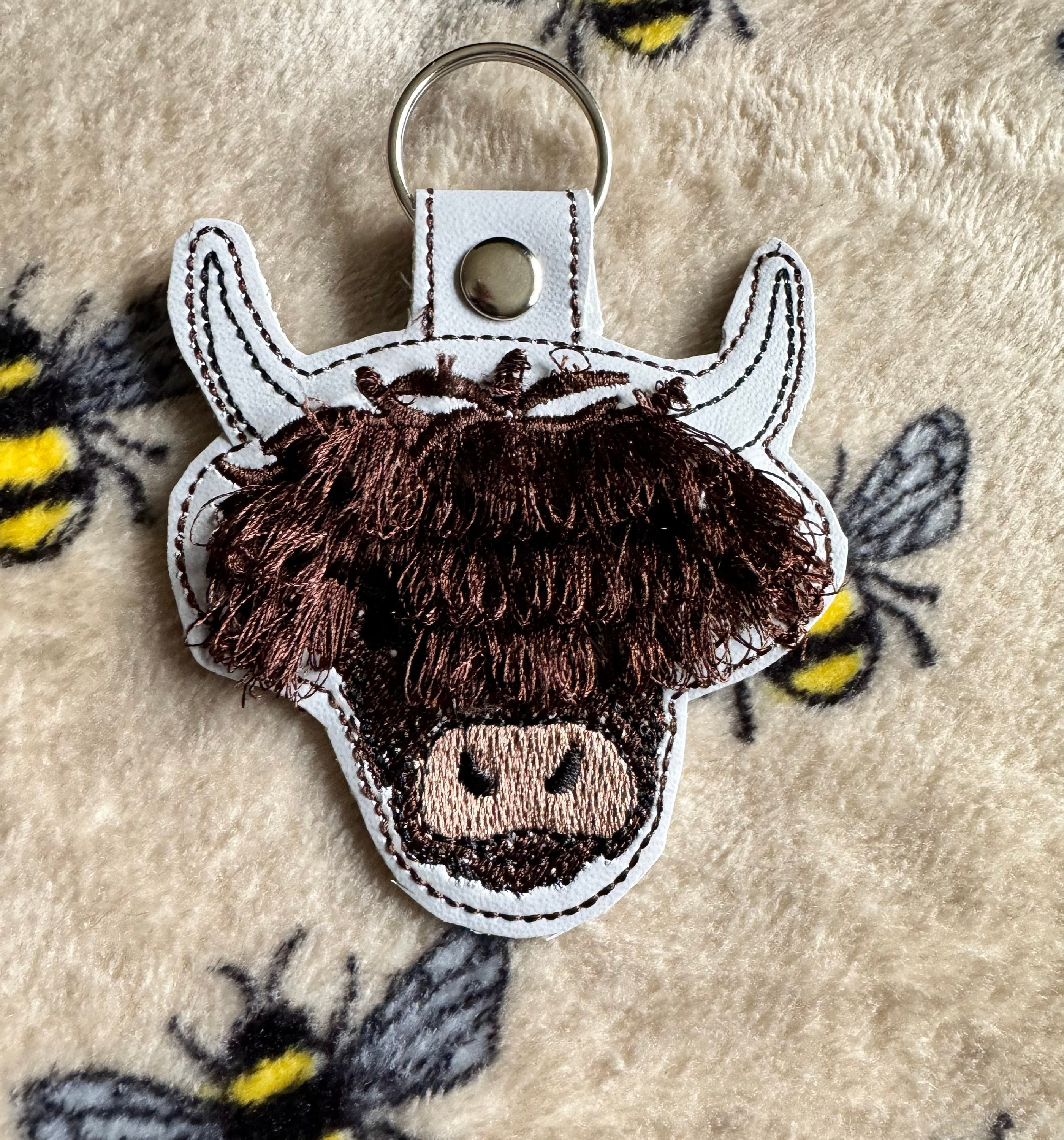 Fringed Highland cow keychain key fob snap tab in the hoop machine embroidery designs ITH project Awesome fluffy fur cow kids backpack tag