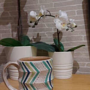 JOANNE added a photo of their purchase