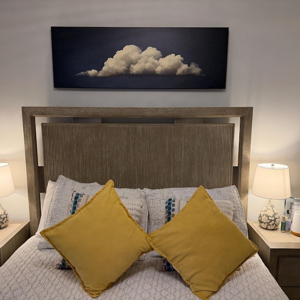 caron's Vintage Clouds Canvas – Panoramic Wall Art | Extra Large Framed Print canvas print in their home — Antarmada
