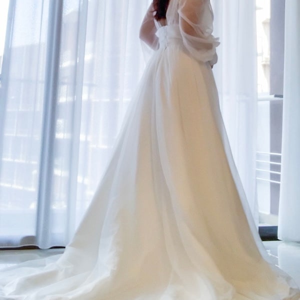 Unique White Princess Bridal Gown with Cascading Ruffles and a Dramatic Silhouette