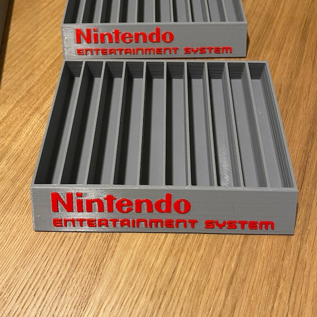 STL file Nintendo NES Cartridge / Game Holder (EASY PRINT) 🐉・3D printer  design to download・Cults