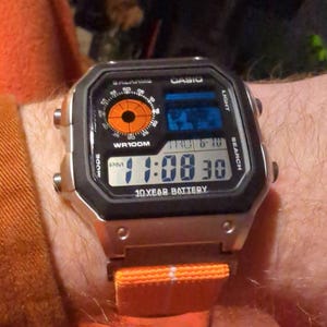 Custom Casio AE-1200 Watch: Silver Case, Orange Elastic Strap