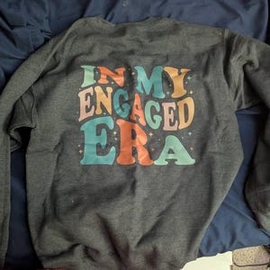 Sasha added a photo of their purchase