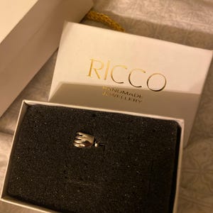 Adriana added a photo of their purchase