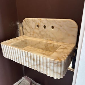 Catherine added a photo of their purchase