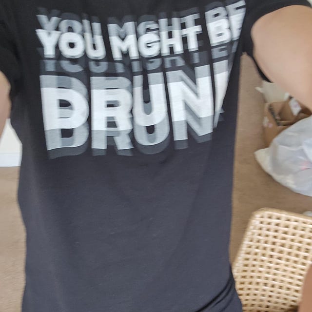 Unboxing a graphic t-shirt as a gift