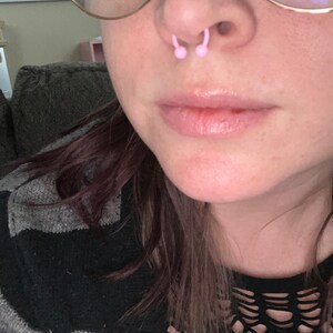 Pink septum shop piercing