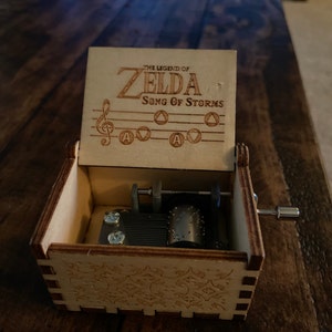  The Legend of Zelda Music Box Hand Crank Musical Box Carved  Wooden,Play Zelda:Song of Storms from Ocarina of Time,Brown : Home & Kitchen