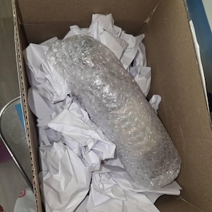 Aisha added a photo of their purchase